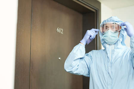 Worker getting ready to disinfect the hotel