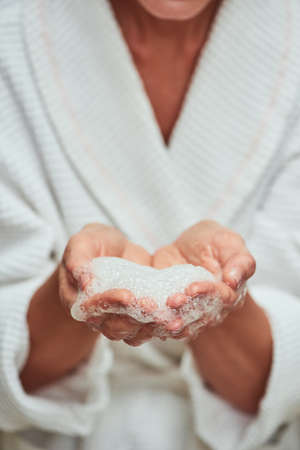 Soap foam in female hands