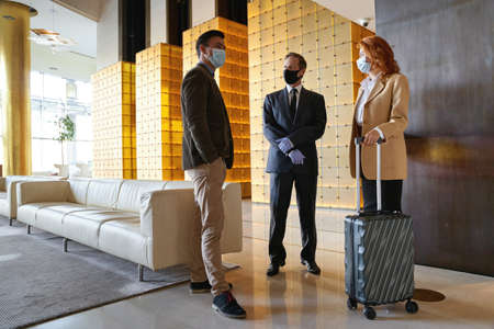 Hotel administrator meeting the guests and talking to them