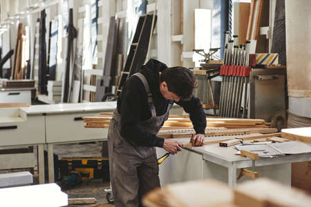 Be Proud Of The Job You Do. Close up of carpenter working at his workstationの写真素材
