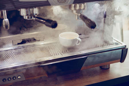 Professional automatic coffee machine brewing coffee in cafeの写真素材