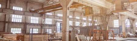 House under construction with ladders and building materialsの写真素材