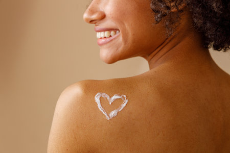 Young positive woman feeling relaxed in studioの写真素材