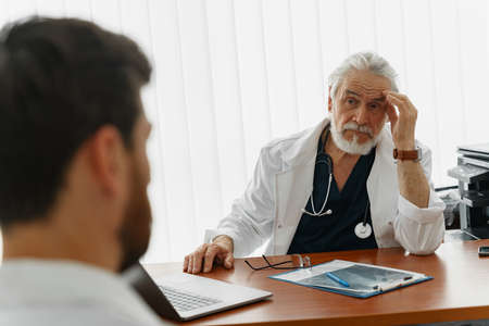 Successful medical doctors are discussing diagnosis during the conferenceの写真素材