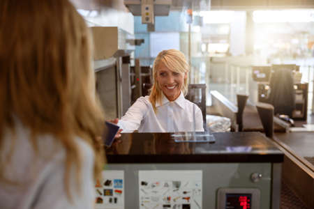 Attractive employee of the control service going to check the documentsの写真素材