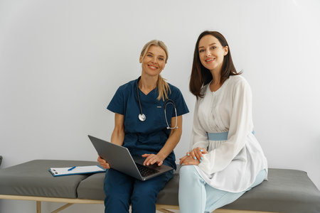 Therapist conducts a preventive examination of a woman in her office and looking cameraの写真素材