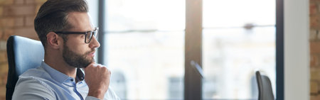 Taking new idea into consideration in quiet atmosphereの写真素材