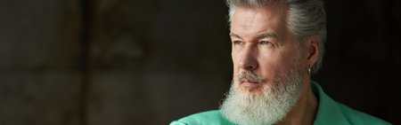 Portrait of stylish modern gray haired mature man with beard weaの写真素材