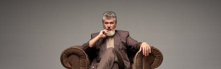 Full length shot of pensive mature businessman with beard wearinの写真素材