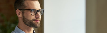 Portrait of attractive Caucasian businessman looking awayの写真素材