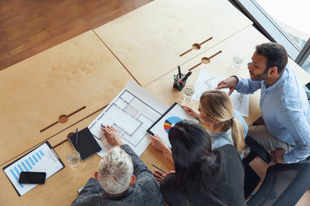 Top view of professional business managers working with project documents in officeの写真素材
