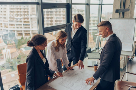 Group of professional business managers working with project documents in office