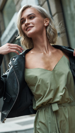 Chic and Stylish Fashion Portrait Featuring a Leather Jacket Along with an Elegant Outfitの写真素材