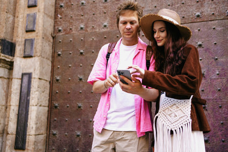 Exploring Together A Young Couple Engaging and Interacting with Technology in the Modern Worldの写真素材