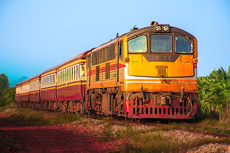Passenger train by diesel locomotive on the railway.の写真素材