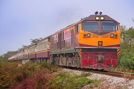 Passenger train by diesel locomotive on the railway.の写真素材