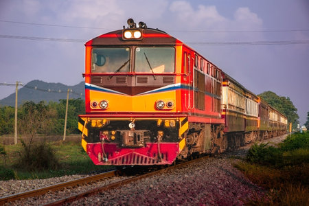 Passenger train by diesel locomotive on the railway.の写真素材