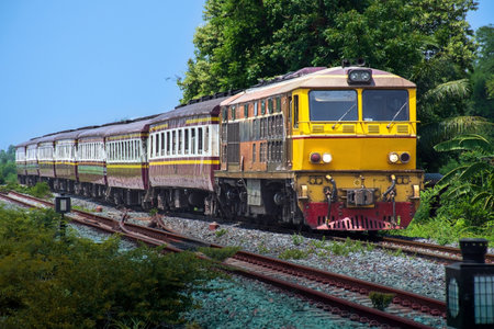 Passenger train by diesel locomotive on the railway.の写真素材