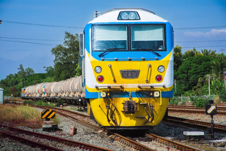 Tanker-freight train by diesel locomotive in the railway yard.
