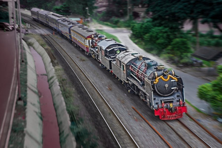 Steam locomotive and train passed the railway curve.の写真素材