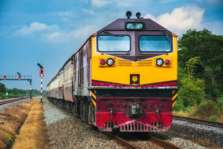 Train on the railway in the countryside of Thailand. Retro style.の写真素材