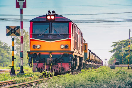 Locomotive with Tanker-freight train  is moving on the railroad in Thailand.の写真素材
