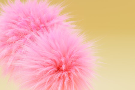 Pink fur balls on a yellow background, 3d renderの写真素材