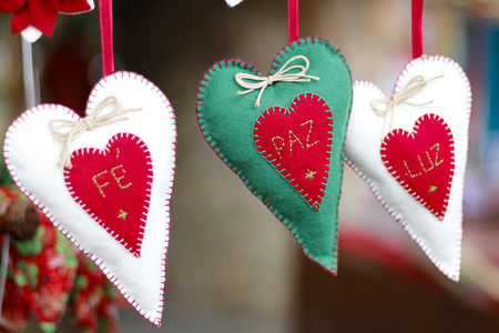 Detail of craftsmanship with Santa and Christmas arrangements for home with peace, peace, lightの写真素材