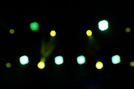 Blurred lights yellow and green with dark scenary - Defocused image - Background concept with light points yellow and green - Blurry bokehの写真素材
