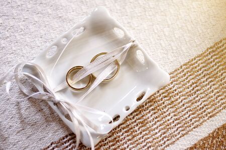 two gold wedding or engagement rings - couple golden rings - two wedding rings