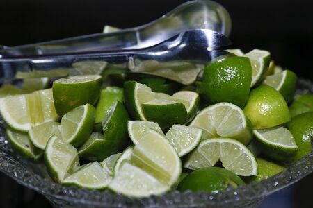 fruit green lemons sliced in glass jarの写真素材