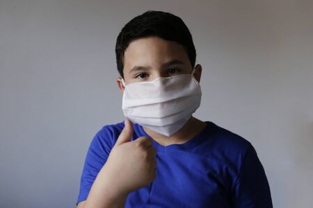 boy wears medical mask for medical treatment and protection Covid-19 coronavirus pollution and respiratory diseasesの写真素材