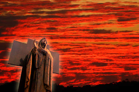 illustrative image of cemetery showing a dark marble angel and neutral sky