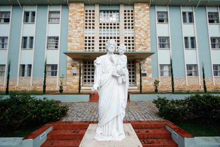 Minas Gerais, Brazil - November 16, 2019: white carved image of Saint Joseph and child Jesus in front of catholic seminary - St Josephのeditorial素材