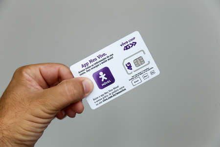 Minas Gerais, Brazil - March 20, 2021: Vivo 4G logo mobile cell phone operator on card with phone...