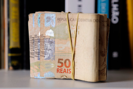 Brazil money stacked and grouped - several Brazilian real banknotes in rubber bandの写真素材