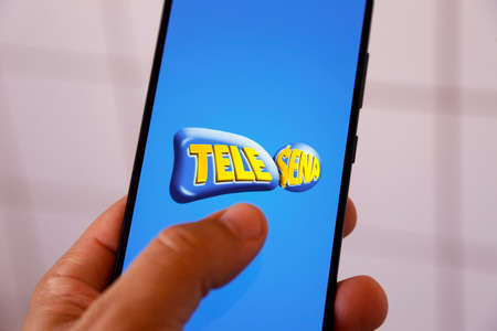 Minas Gerais, Brazil - April 23, 2022: smartphone cell phone screen with Tele Sena brand
