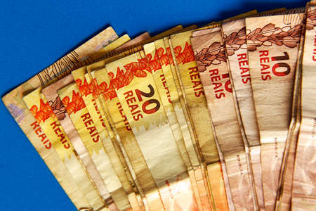 several ten and twenty Brazilian real notes - twenty highlightedの写真素材