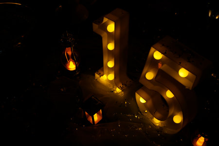 number fifteen with lights at 15th birthday party - top view - light partyの写真素材