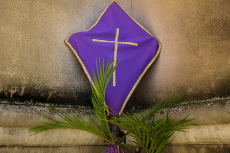 Holy Week. Cross covered with purple fabric in the period of lent. Traditional Catholic celebration...