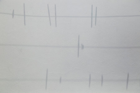 shadow on the wall of clothesline and clothespinsの写真素材