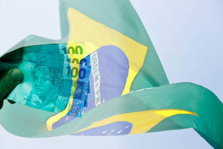 stacked brazil money and brazil flag in motionの写真素材