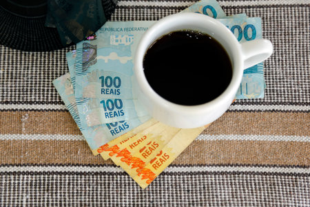 cup of coffee and banknotes of real money from brazilの写真素材