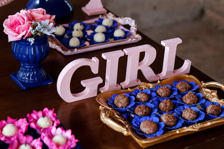 big rose letters GIRL and candy on the table at revelation tea party - baby gender reveal party conceptの写真素材