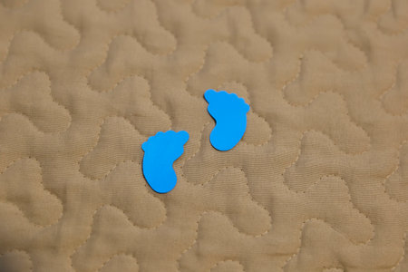 two blue feet child or baby drawing format - feet symbol in blue colorの写真素材
