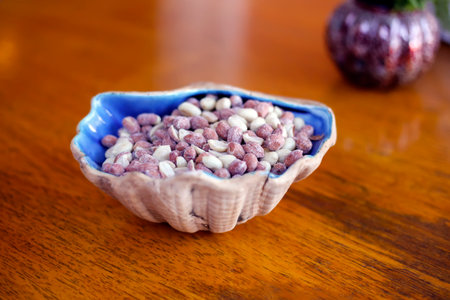 Image of an artisanal clay pot filled with roasted peanuts, perfect for cooking, natural snacks, and...