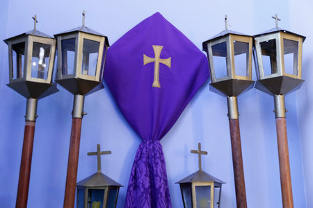 Catholic liturgical composition featuring purple fabric, veiled statues for veil, and glowing...