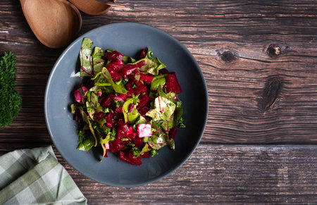 Beetroot salad with vegan feta, beetroot chard and spinach. Healthy food concept. Dieting concept. vegan diet. Shot from above.の写真素材