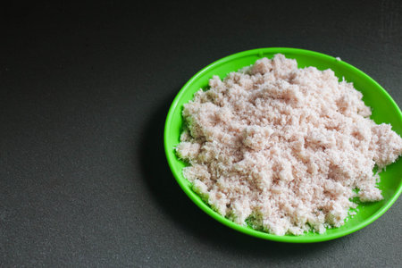 Grated coconut on a dark background