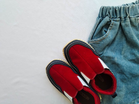 Children's clothing set of pants, shirt and shoesの写真素材